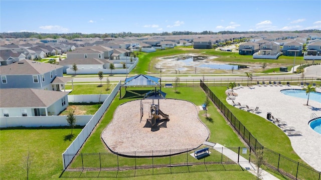 aerial view featuring a residential view and a water view