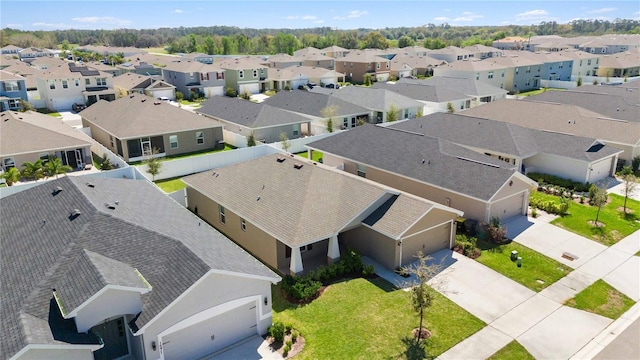 birds eye view of property with a residential view