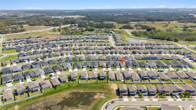 birds eye view of property with a residential view