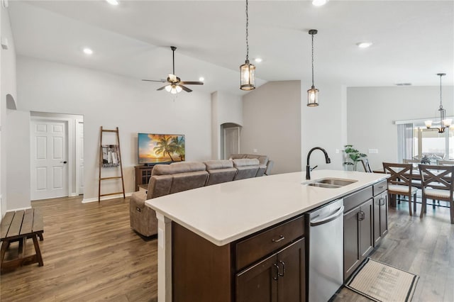 1575 Eucalyptus Way, Davenport, FL 33837 - kitchen with stainless steel dishwasher, wood finished floors, light countertops, a ceiling fan, and arched walkways