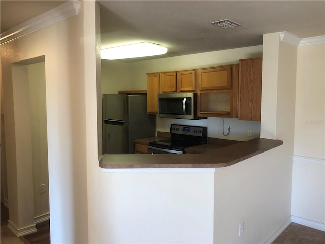 kitchen with stainless steel appliances, visible vents, brown cabinetry, ornamental molding, and a peninsula