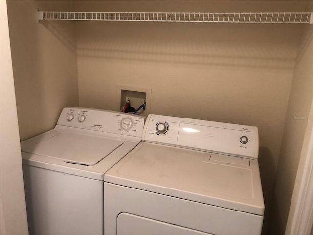 laundry area with laundry area and separate washer and dryer