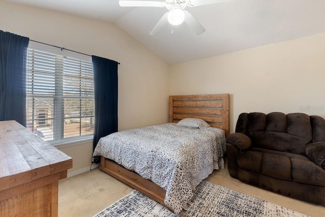 bedroom with vaulted ceiling, baseboards, a ceiling fan, and light colored carpet