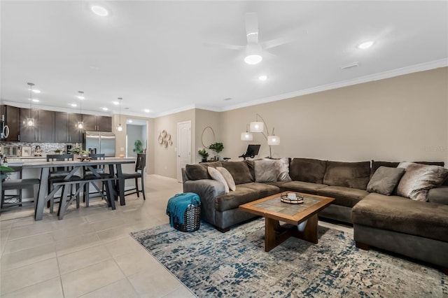 living room featuring a ceiling fan, recessed lighting, light tile patterned flooring, and crown molding