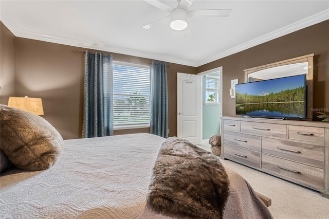 bedroom with a ceiling fan, light colored carpet, and crown molding