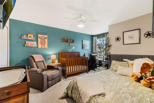 carpeted bedroom with a ceiling fan