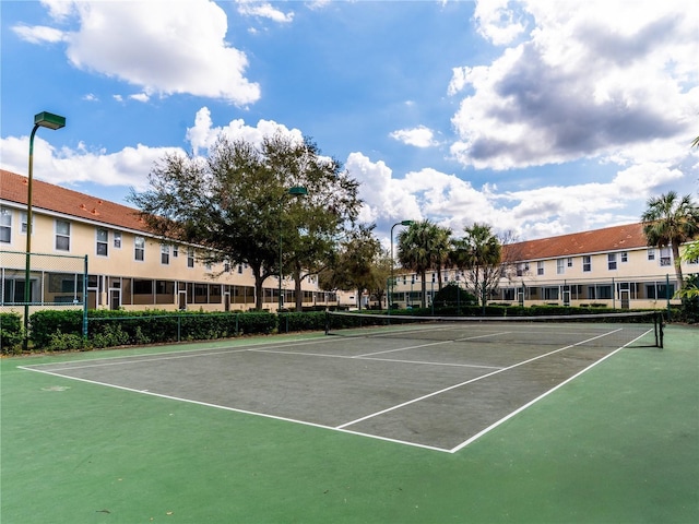 view of sport court with fence