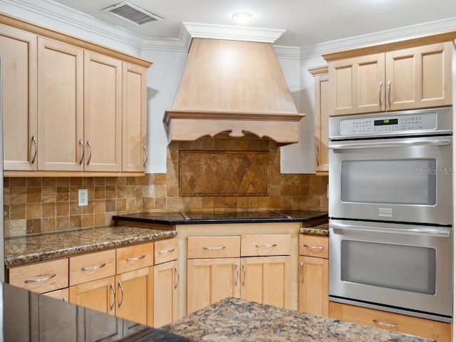 kitchen with cooktop, visible vents, custom exhaust hood, stainless steel double oven, and light brown cabinets