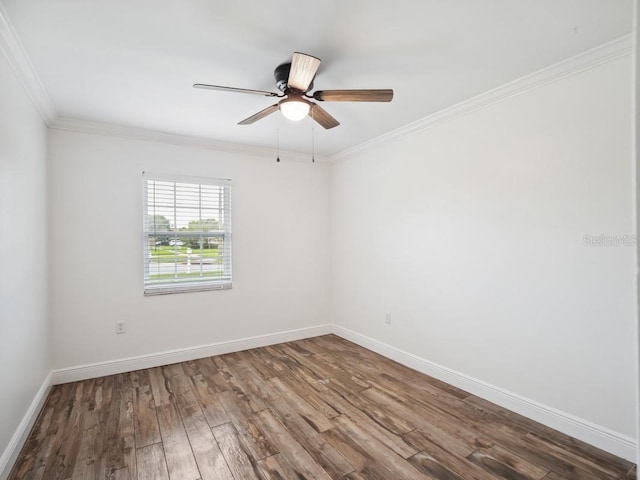 spare room featuring ceiling fan, baseboards, wood finished floors, and ornamental molding