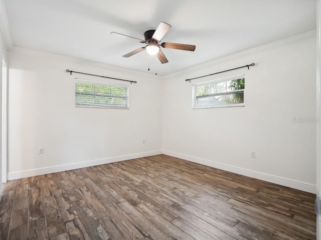 unfurnished room with a healthy amount of sunlight, crown molding, and wood finished floors