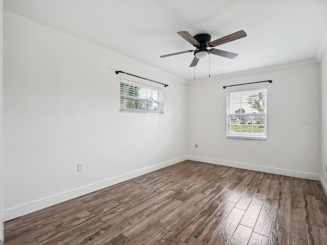 unfurnished room with ornamental molding, a ceiling fan, baseboards, and wood finished floors