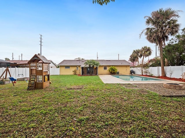 view of yard with a fenced in pool and a fenced backyard