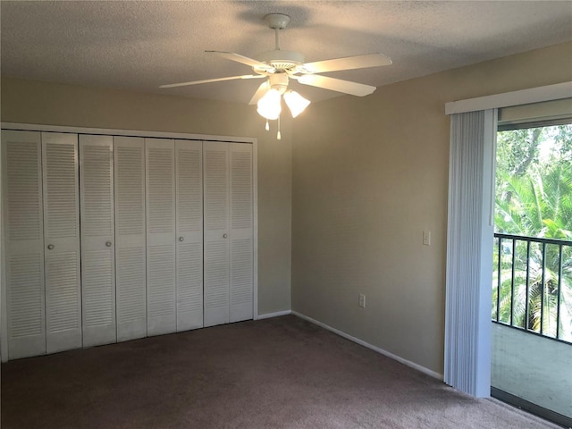 unfurnished bedroom featuring a closet, carpet flooring, ceiling fan, and a textured ceiling
