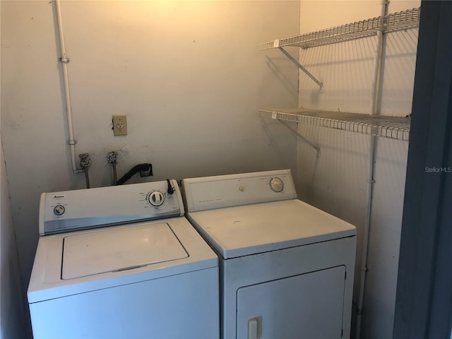 laundry area featuring laundry area and washing machine and clothes dryer
