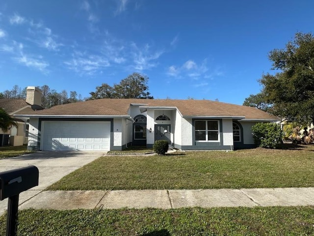 single story home with a garage, driveway, a front lawn, and stucco siding