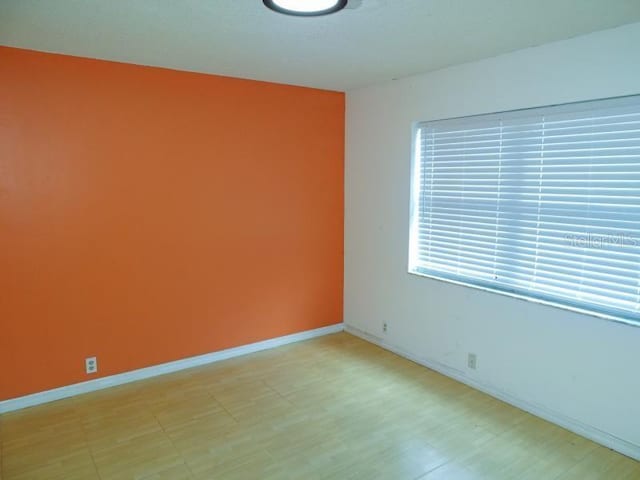 empty room featuring baseboards