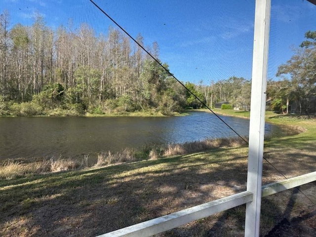 water view featuring a wooded view