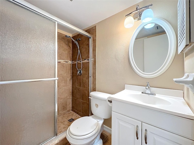 562 Orange Dr Unit 33, Altamonte Springs, FL 32701 - bathroom with visible vents, toilet, a shower stall, vanity, and a textured wall