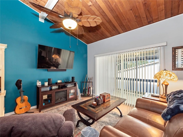 living room with lofted ceiling, ceiling fan, a fireplace, wood ceiling, and baseboards