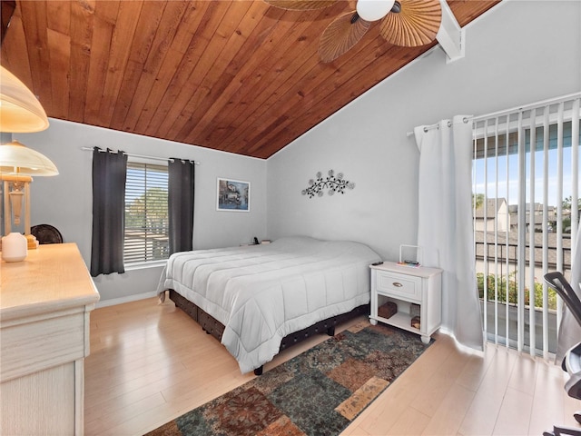 bedroom with lofted ceiling, wood finished floors, wood ceiling, and baseboards