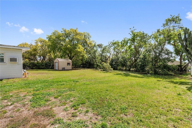 view of yard with an outbuilding and a storage shed