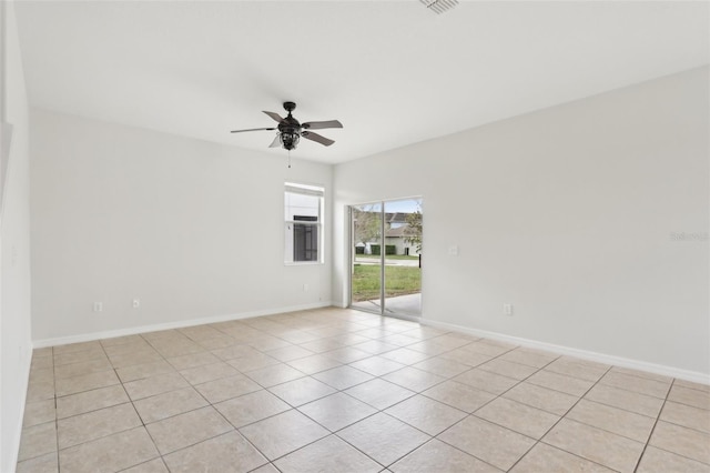 1893 Rafton Rd, Apopka, FL 32703 - spare room with light tile patterned floors, a ceiling fan, and baseboards