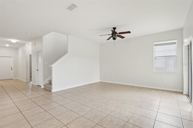 1893 Rafton Rd, Apopka, FL 32703 - spare room with visible vents, baseboards, a ceiling fan, stairs, and light tile patterned flooring