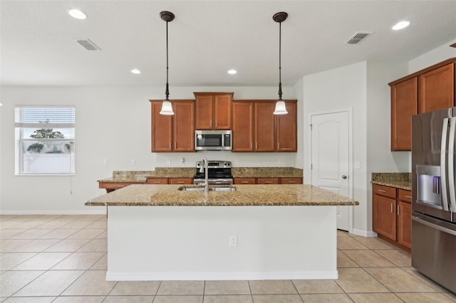 1893 Rafton Rd, Apopka, FL 32703 - kitchen featuring appliances with stainless steel finishes, stone countertops, visible vents, and a sink