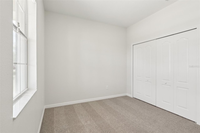1893 Rafton Rd, Apopka, FL 32703 - unfurnished bedroom with a closet, carpet, and baseboards