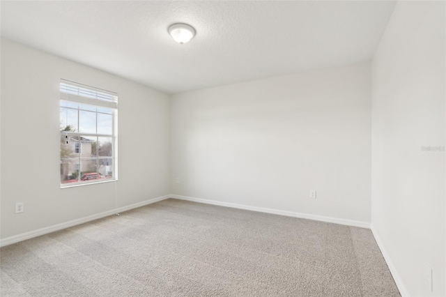 1893 Rafton Rd, Apopka, FL 32703 - empty room featuring baseboards, a textured ceiling, and light colored carpet