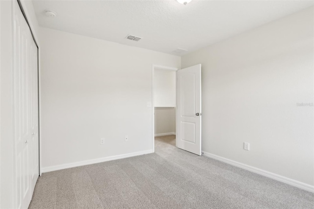 1893 Rafton Rd, Apopka, FL 32703 - unfurnished bedroom featuring carpet floors, a closet, visible vents, and baseboards