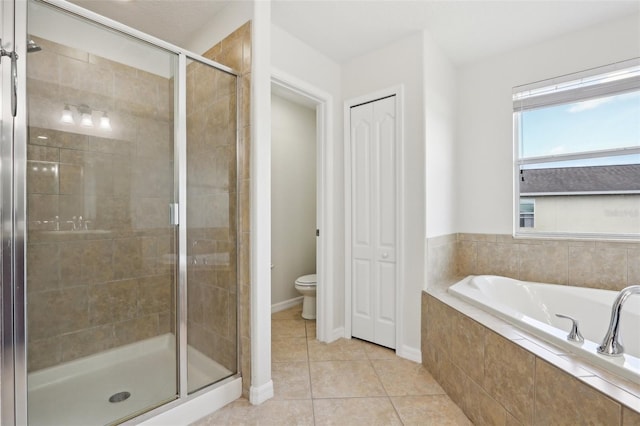1893 Rafton Rd, Apopka, FL 32703 - full bathroom featuring toilet, baseboards, a shower stall, a bath, and tile patterned floors
