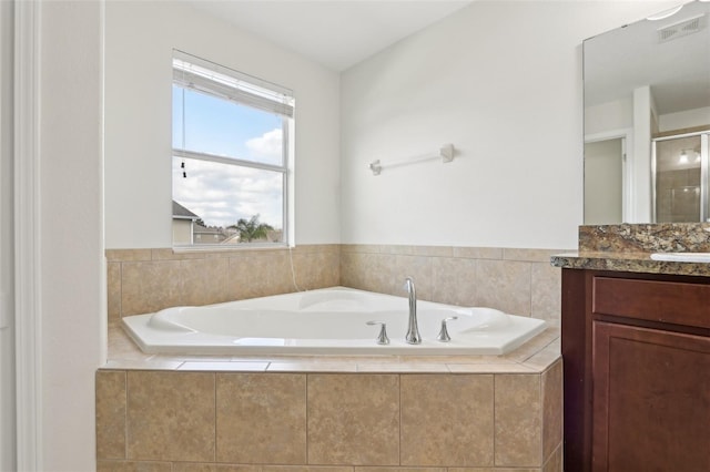1893 Rafton Rd, Apopka, FL 32703 - bathroom featuring visible vents, an enclosed shower, vanity, and a bath