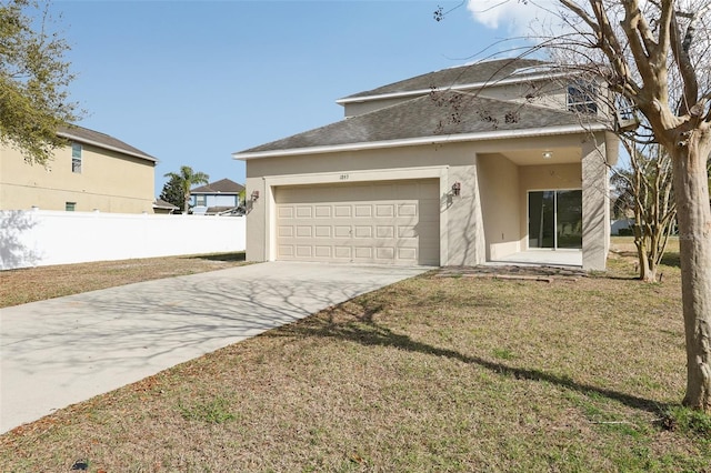 1893 Rafton Rd, Apopka, FL 32703 - traditional-style house with stucco siding, concrete driveway, a front yard, fence, and a garage