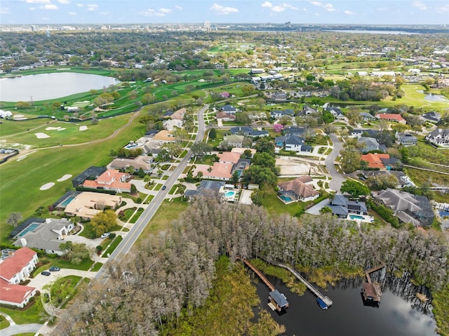 bird's eye view with golf course view, a water view, and a residential view