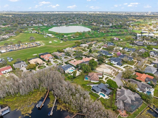 drone / aerial view with a water view, a residential view, and golf course view