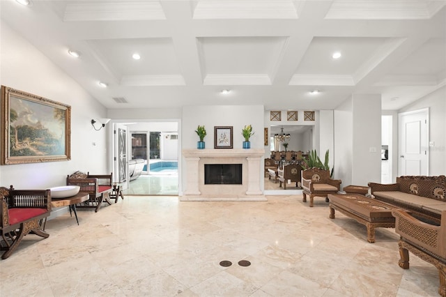 living room with beamed ceiling, coffered ceiling, and a fireplace