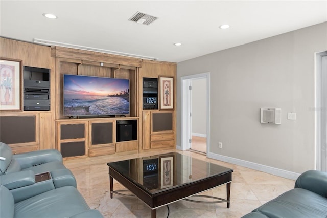 cinema room with baseboards, built in shelves, visible vents, and recessed lighting