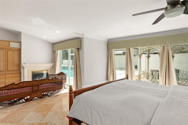 bedroom with baseboards, vaulted ceiling, access to exterior, ornamental molding, and a glass covered fireplace