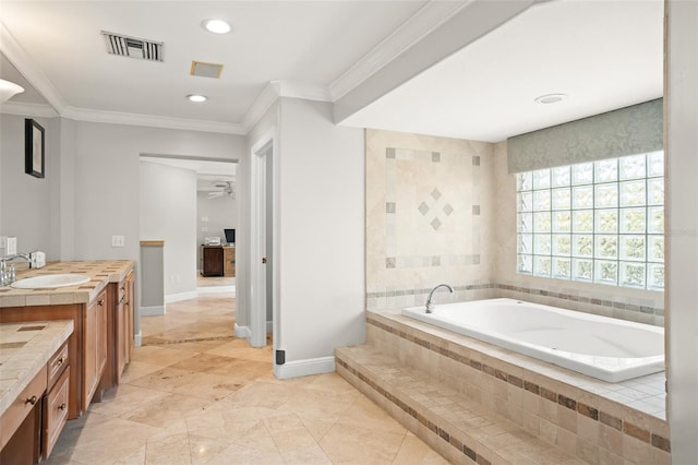 bathroom with baseboards, visible vents, a garden tub, crown molding, and vanity