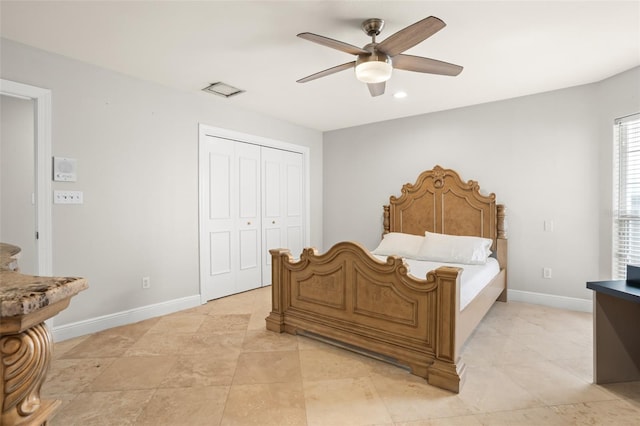 bedroom featuring a closet, a ceiling fan, and baseboards