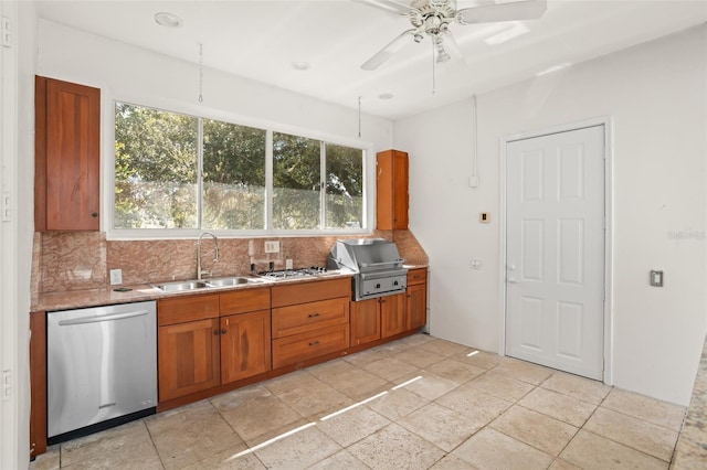 kitchen with a sink, decorative backsplash, brown cabinetry, and stainless steel dishwasher