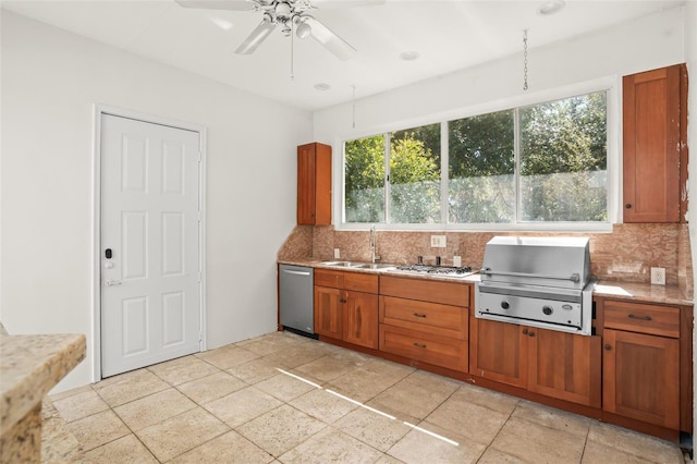 kitchen featuring a sink, stainless steel dishwasher, backsplash, and brown cabinets