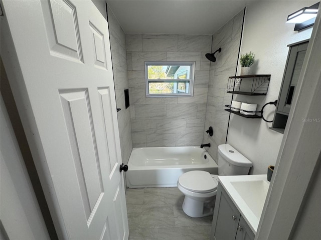 bathroom featuring marble finish floor, vanity, toilet, and bathing tub / shower combination