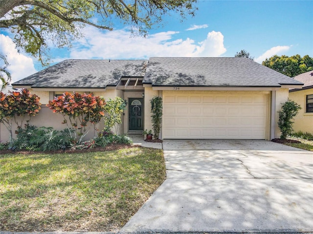 ranch-style house featuring concrete driveway, a shingled roof, an attached garage, and stucco siding