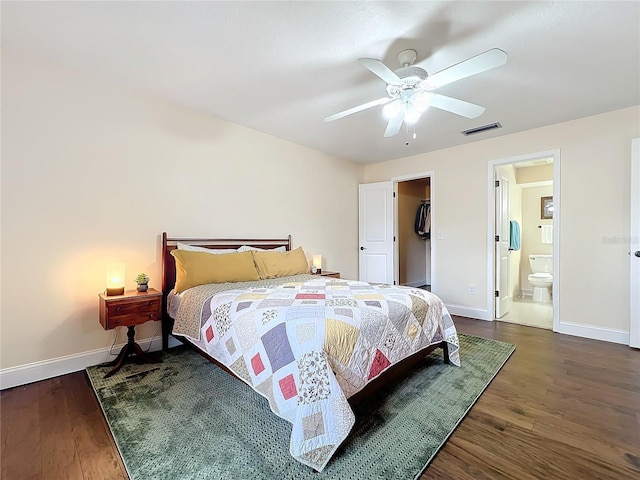 bedroom featuring wood finished floors, visible vents, and baseboards