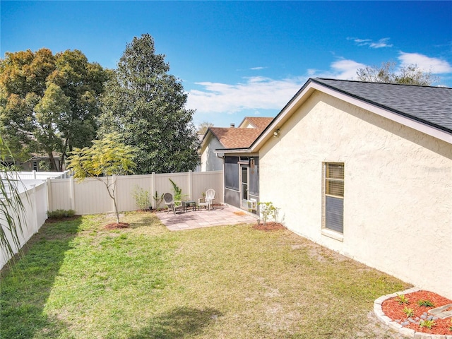 view of yard with a fenced backyard and a patio