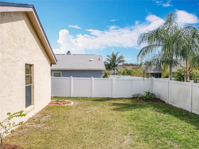 view of yard with a fenced backyard