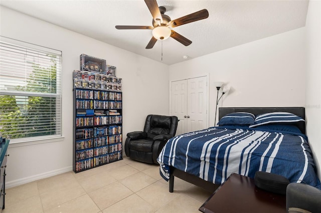 2817 Noble Crow Dr, Kissimmee, FL 34744 - bedroom with ceiling fan, baseboards, a closet, and tile patterned floors
