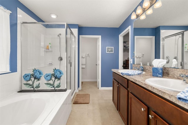 2817 Noble Crow Dr, Kissimmee, FL 34744 - bathroom featuring double vanity, a stall shower, a sink, tile patterned floors, and a bath